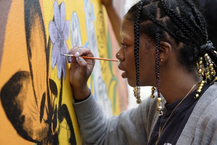 Students create unifying mural for New Covenant